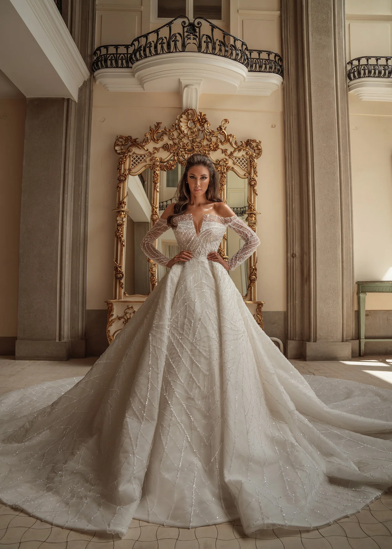 Sahar's Bridal — couture bride in ivory silk and lace within a sunlit marble hall